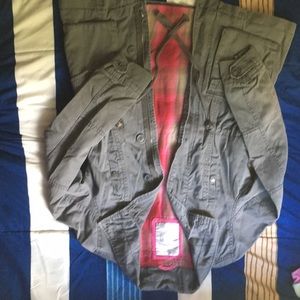 A grey butttoned  jacket